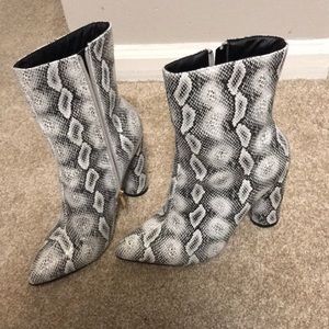 Snakeskin heeled booties